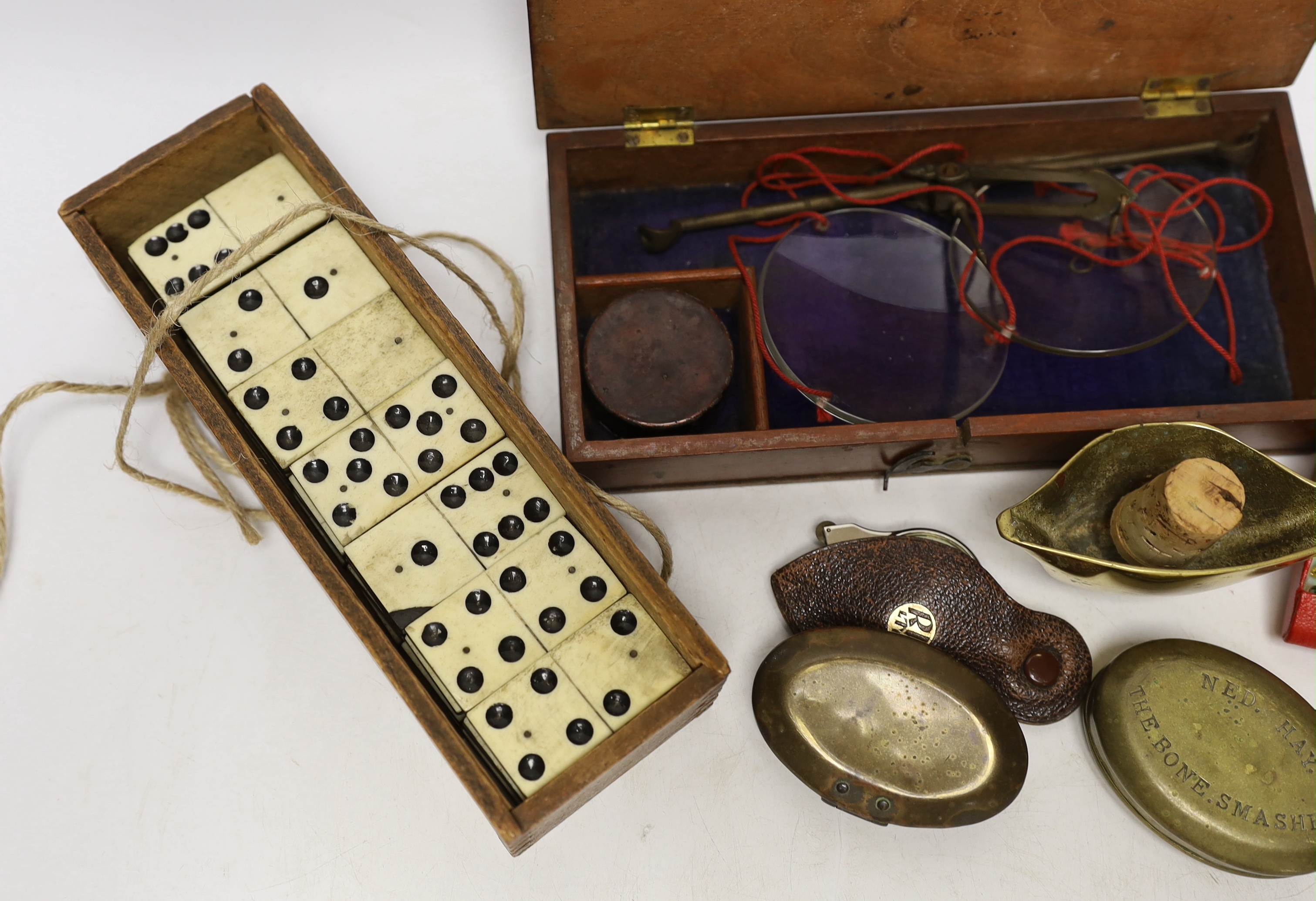 A boxed set of pan scales, a set of bone dominoes, two miner's snuff boxes, etc.